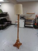An Arts & Crafts standard lamp with shade