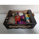 A box containing vintage film reels.