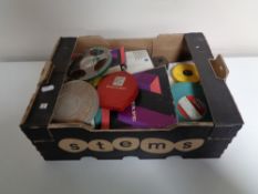 A box containing vintage film reels.