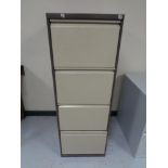 A Triumph four drawer filing cabinet