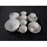 A 19 piece English bone china rose patterned tea service.