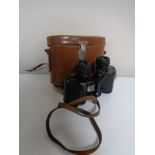 A vintage set of Wray of London 8 x 30 field glasses in leather case.