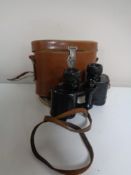 A vintage set of Wray of London 8 x 30 field glasses in leather case.