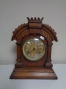 A 19th century oak cased American mantel clock by The Ansonia Clock Company.