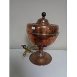 An antique copper and brass urn.