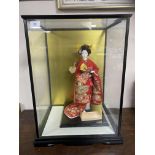 A contemporary matte-glazed Japanese doll/ornament,