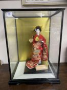 A contemporary matte-glazed Japanese doll/ornament,