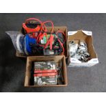 Two boxes and a wooden crate containing halogen flood lights, car jump starters, car buffer,