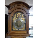 A continental scumbled-cased longcase clock, dial signed Hans Nielson, with pendulum and weights.