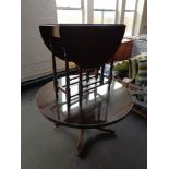 A circular inlaid mahogany pedestal coffee table together with an oak gateleg table