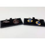 Two pairs of silver and enamelled cuff links
