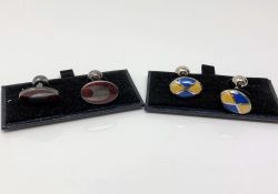 Two pairs of silver and enamelled cuff links