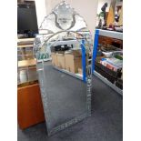 A contemporary all glass Venetian style wall mirror (AF).