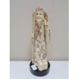 A Japanese carved bone okimono, figure with staff,