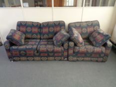 A two seater settee and armchair in multi coloured print