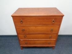 A mid 20th century four drawer vanity chest.