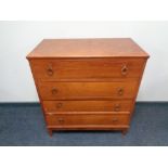 A mid 20th century four drawer vanity chest.