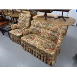 A twentieth century armchair and two seater settee in classical fabric