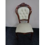 A stained beech framed Italianate dining chair upholstered in cream leather.