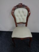 A stained beech framed Italianate dining chair upholstered in cream leather.