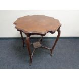 A shaped Edwardian mahogany occasional table.
