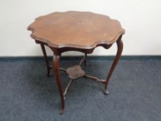 A shaped Edwardian mahogany occasional table.