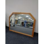 A large pine framed overmantel mirror together with a pine framed nursery print and one other