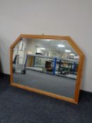 A large pine framed overmantel mirror together with a pine framed nursery print and one other