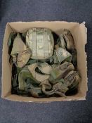A box of army surplus webbing and pouches