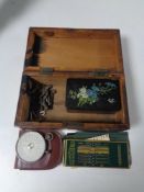 An antique marquetry trinket box containing a further black lacquer trinket box, assorted keys,