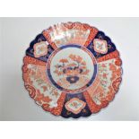 A 19th century Japanese Imari scalloped edged plate.