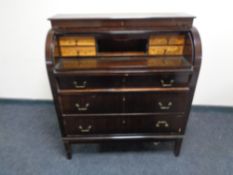 A 20th century cylinder bureau, fitted three drawers.