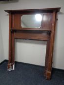 An Edwardian inlaid mahogany mirrored fire surround