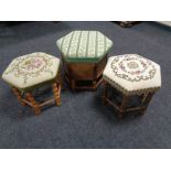 Two hexagonal tapestry upholstered foot stools together with a further oak storage box with