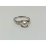 A 14ct white gold pearl ring, size R CONDITION REPORT: 2.