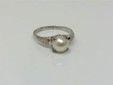 A 14ct white gold pearl ring, size R CONDITION REPORT: 2.