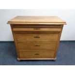 A 19th century continental elm four drawer chest.