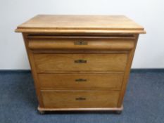 A 19th century continental elm four drawer chest.