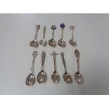 Ten silver crested teaspoons.