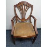 An antique mahogany Hepplewhite style dining chair.