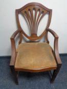 An antique mahogany Hepplewhite style dining chair.