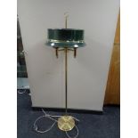 A brass three way floor lamp with metal shade (continental wiring).