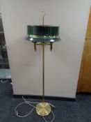 A brass three way floor lamp with metal shade (continental wiring).