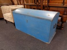 An antique painted dome topped shipping trunk.