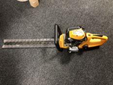 A JCB petrol hedge trimmer.