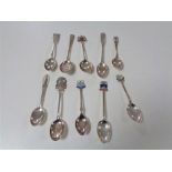 Ten silver crested teaspoons.