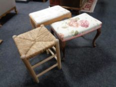 A pine dressing table stool together with a carved beech dressing table stool and a further pine