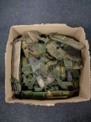 A box of army surplus webbing and pouches