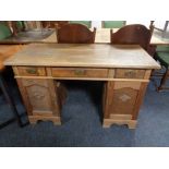 An early 20th century oak twin pedestal desk.