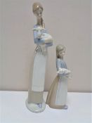 Two Lladro figures, Girl with Lamb and Girl with Pig.